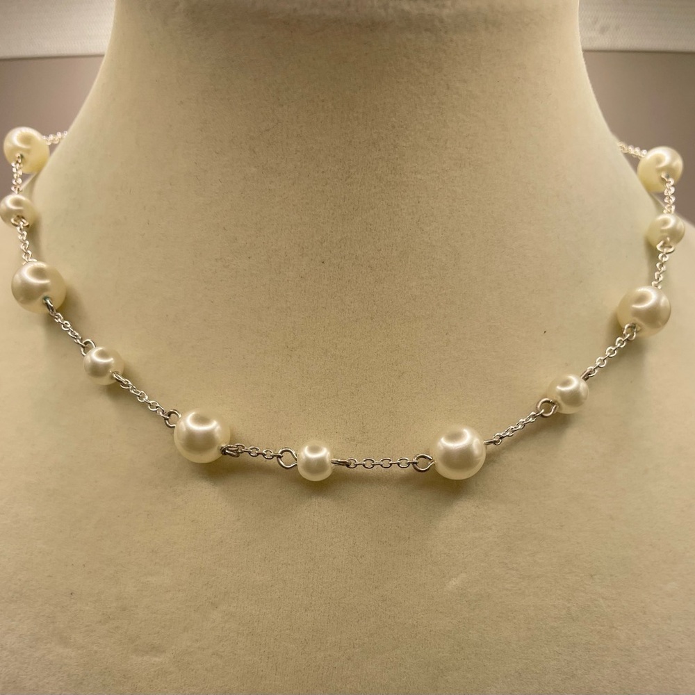 Silver tone white faux pearl station necklace. 16 inches with 2 1/2 inch extend.